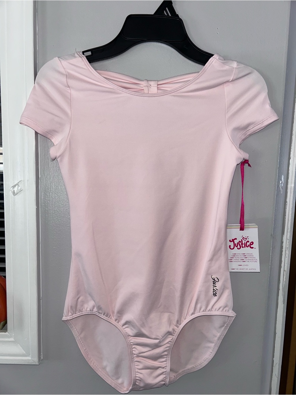 Justice Light Pink Short Sleeve Girls One-Piece Bodysuit